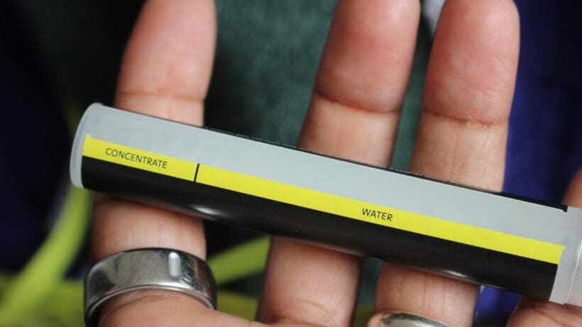 form smart swim 2 pro anti-fog spray in hand