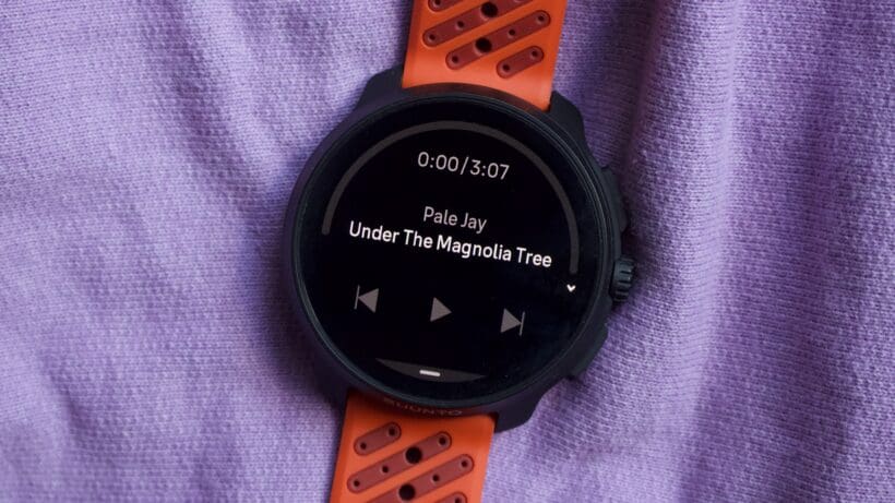 sports watch showing music controls